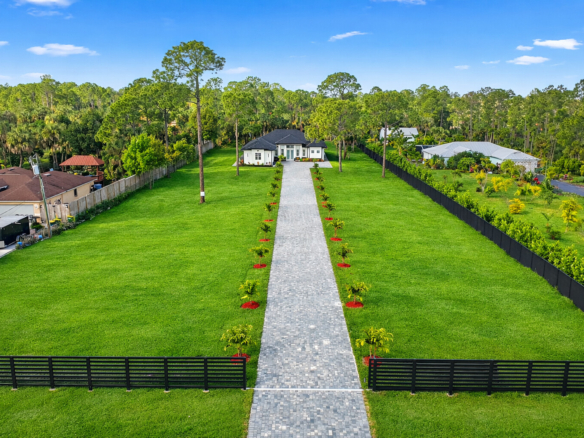 Aerial View of 1687 19th St SW featuring a gated and fully fenced property. Huge Acreage