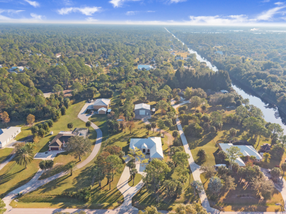 Aerial view of golden gate estates near lake/canal. No HOA