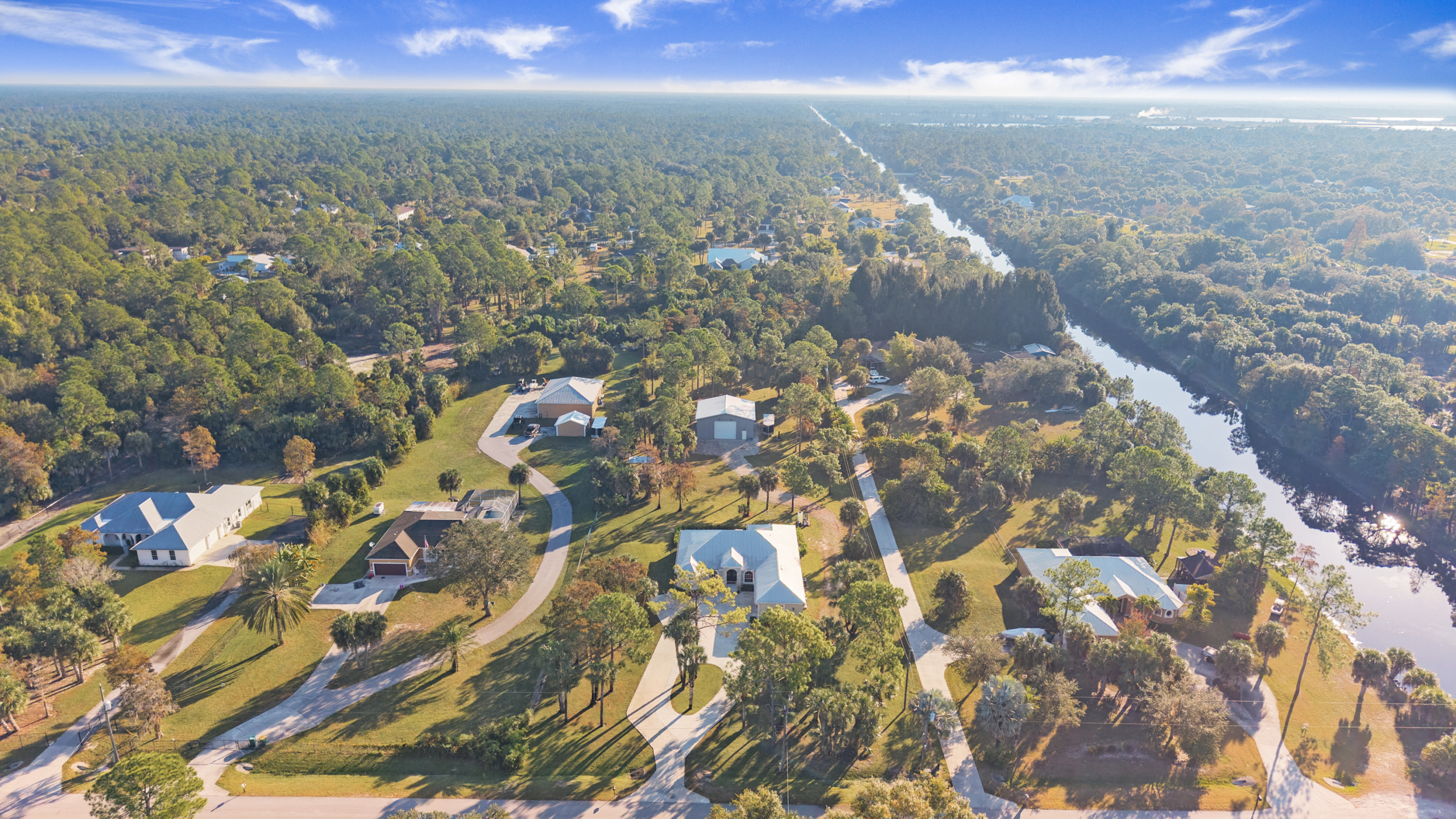 Aerial view of golden gate estates near lake/canal. No HOA
