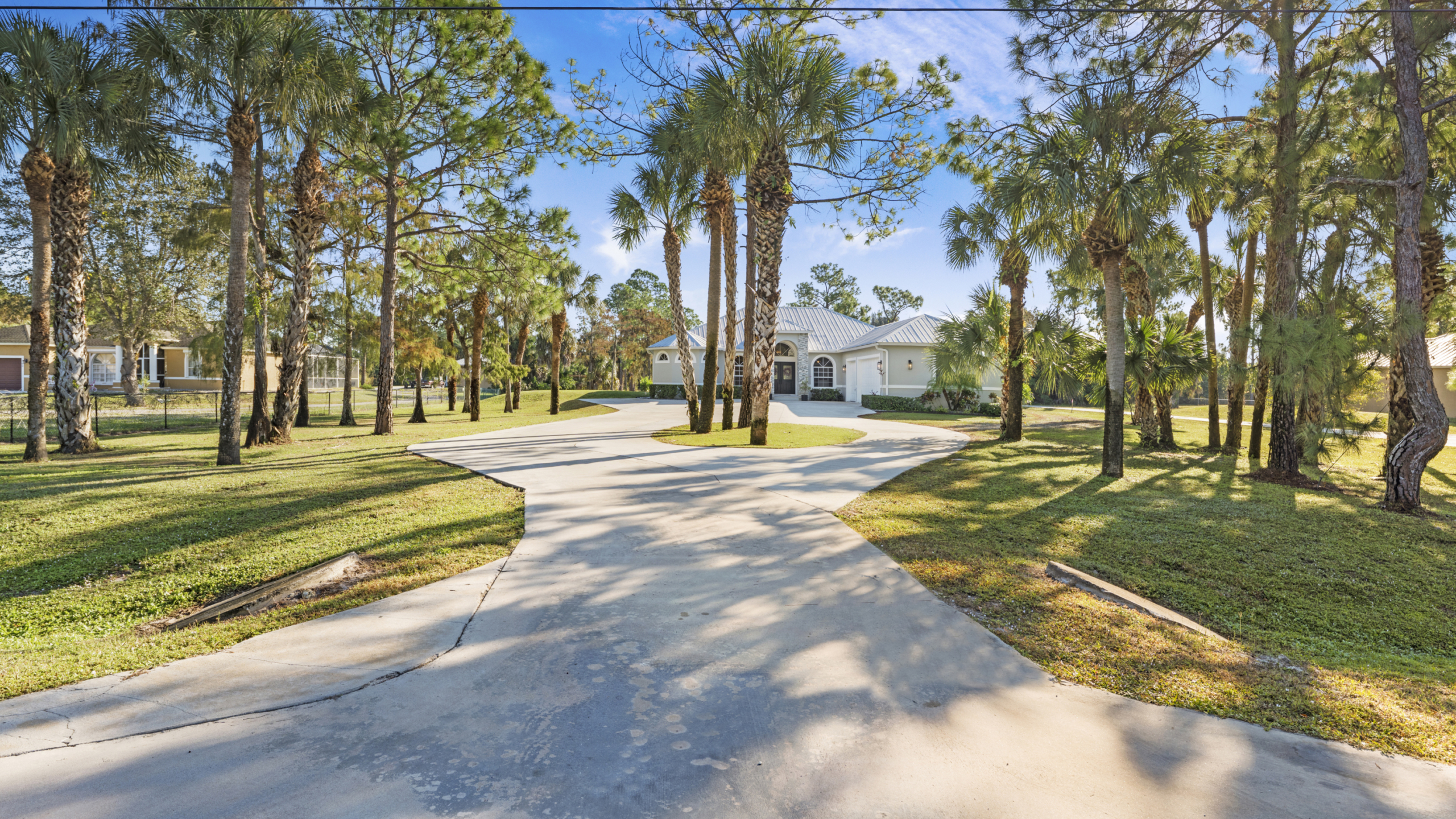Front view of a property with trees. Really nice landscaping in golden gate estates. Property is 770 17th St SW