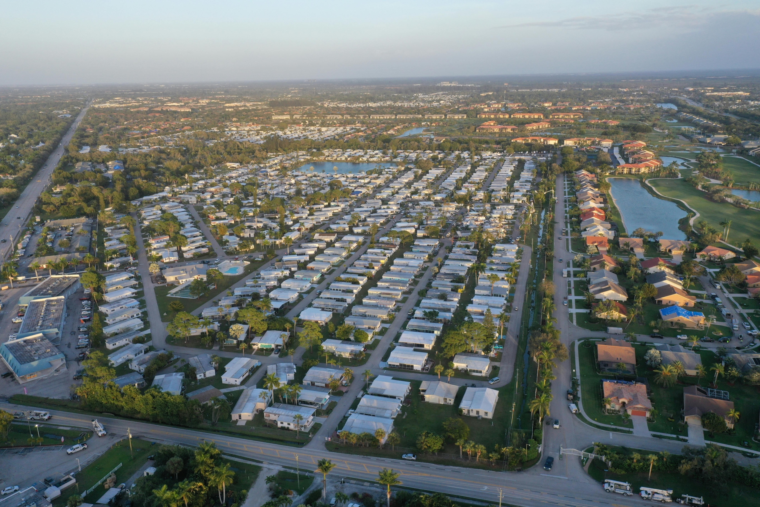 Aerial photo showcasing a suburban neighborhood in Fort Myers, Florida, with clear skies and organized streets.