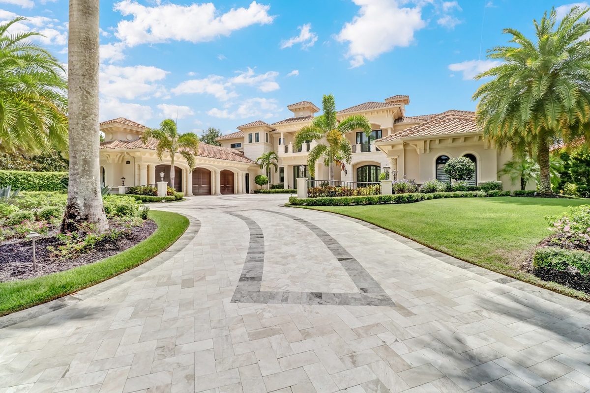 Mediterranean-style luxury home with travertine motor court in Naples, Florida