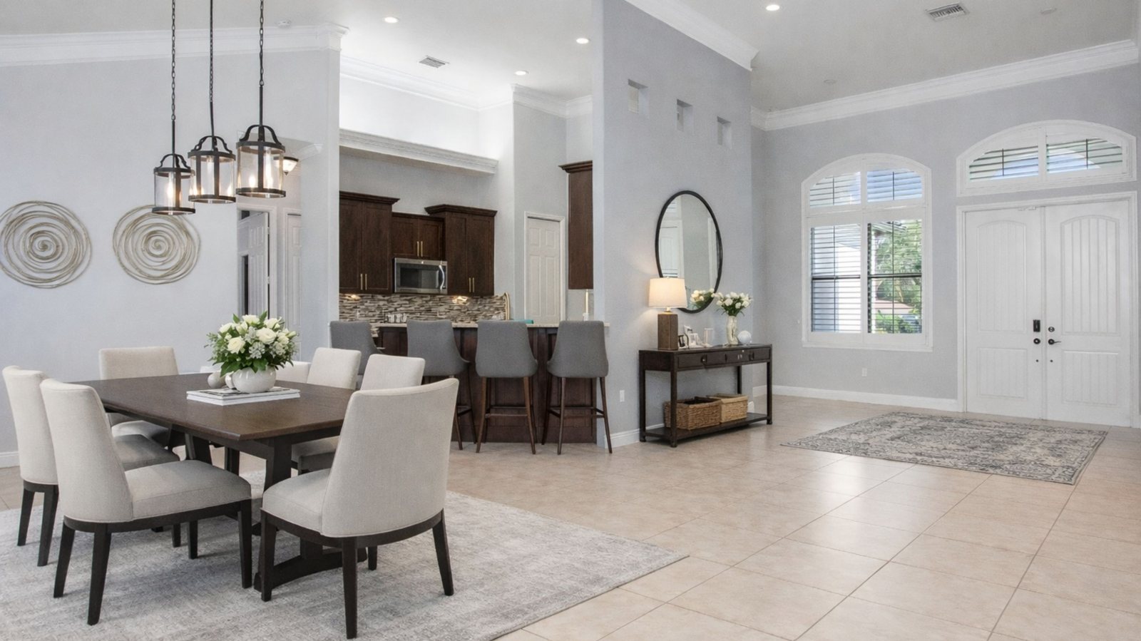Open-concept dining room and kitchen with granite counters at 6341 Green Blvd, Naples FL