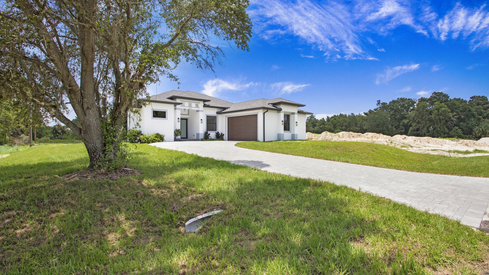 Modern family home on a green lot in Naples, Florida — the kind of next-chapter home growing families move up to