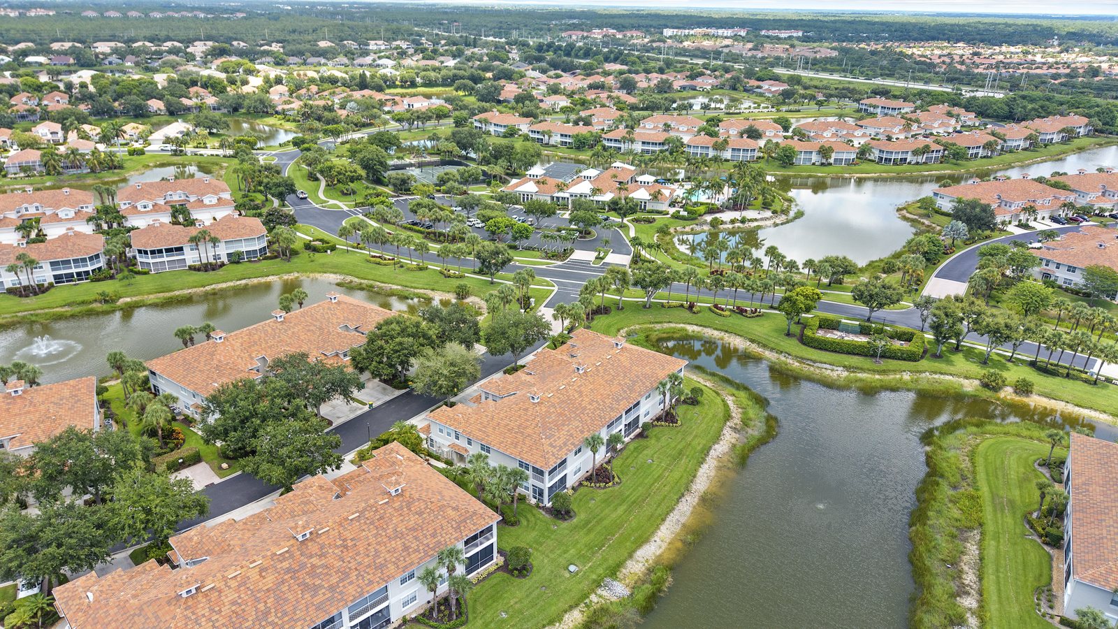 Aerial view of Naples, Florida neighborhoods, lakes and golf communities illustrating the 2026 housing market