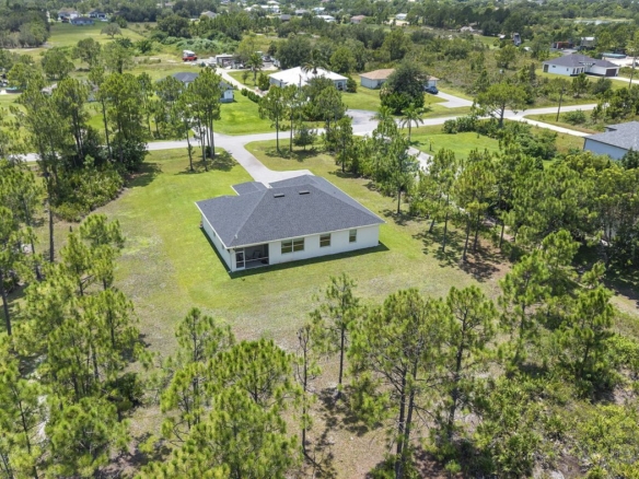 Aerial view of a 2021-built home on 2.5 acres in the northeast Golden Gate Estates, Naples, Florida