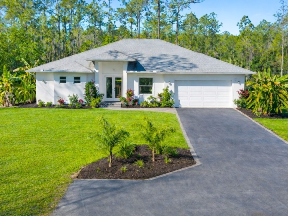 Single-family home with landscaped lawn and driveway in Naples, Florida — the kind of property owners want valued