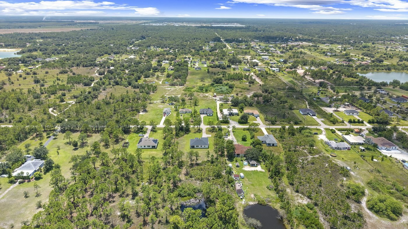 Wide aerial of Golden Gate Estates acreage lots, homes and lakes in Naples, Florida