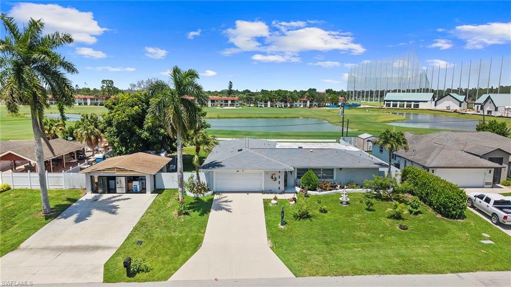 4109 29th Pl SW Naples, Golden Gate City pool home on the golf course, aerial