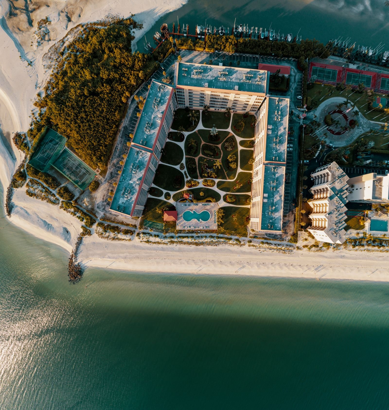 Aerial of the beachfront and Gulf waters in Bonita Springs, Florida