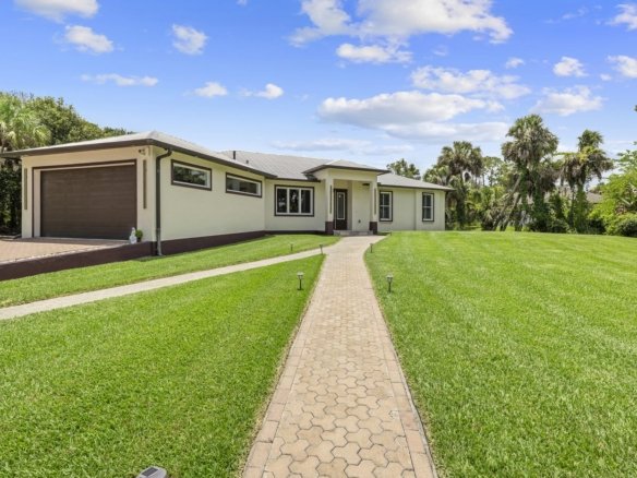 Single-story home on 2.81 acres in Golden Gate Estates, Naples, Florida, with a whole-house generator and propane